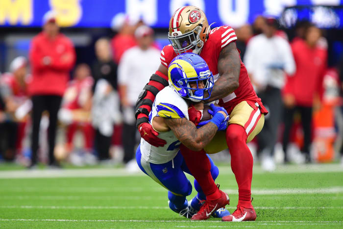 Sep 17, 2023; Inglewood, California, USA; Los Angeles Rams running back Kyren Williams (23) is brought down by San Francisco 49ers linebacker Dre Greenlaw (57) during the first half at SoFi Stadium. Mandatory Credit: Gary A. Vasquez-USA TODAY Sports